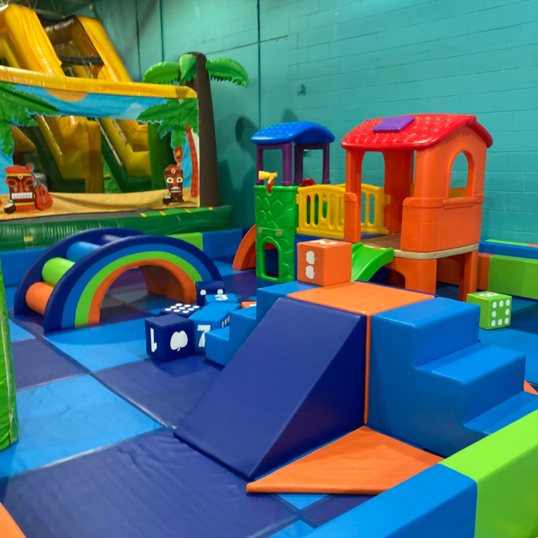 A vibrant play area filled with colorful and soft play equipment designed for toddlers or small children