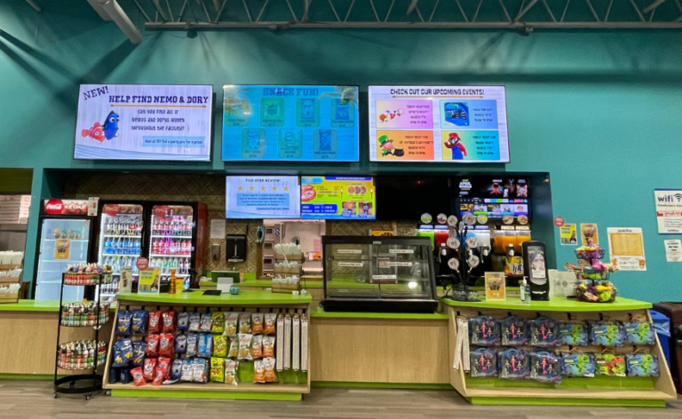 A food counter showcasing a large array of food and drinks in an organized display, inviting customers to order food.