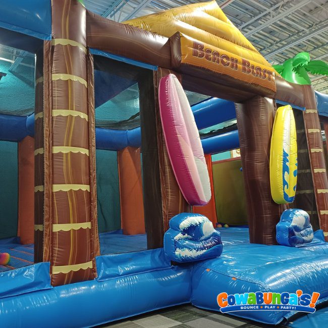 Tropical-themed inflatable entrance at Cowabunga’s Manchester, NH