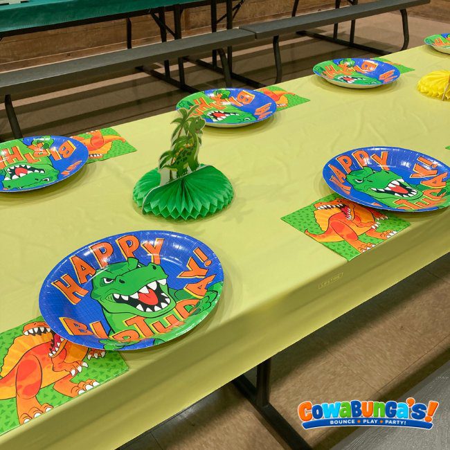 Colorful place settings on a party table at Cowabunga’s Manchester, NH