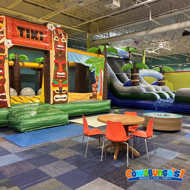 Tiki-themed inflatable and small play tables at Cowabunga’s North Reading, MA