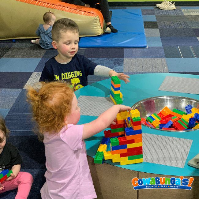 Children building with colorful play bricks at Cowabunga’s North Reading, MA
