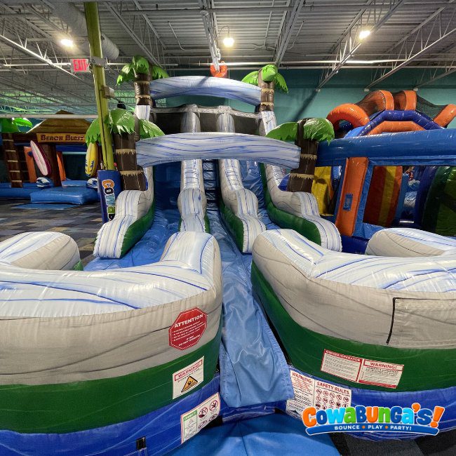 Inflatable attractions in the indoor play space at Cowabunga’s North Reading, MA